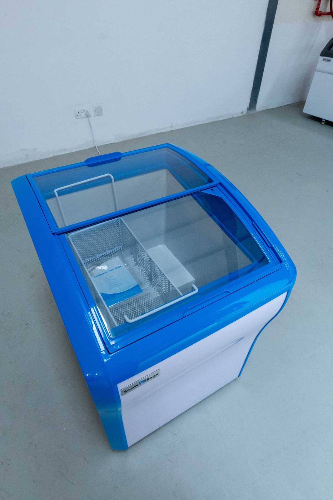Snow Village 158L display freezer chiller, open top view showing sliding glass lids and interior basket